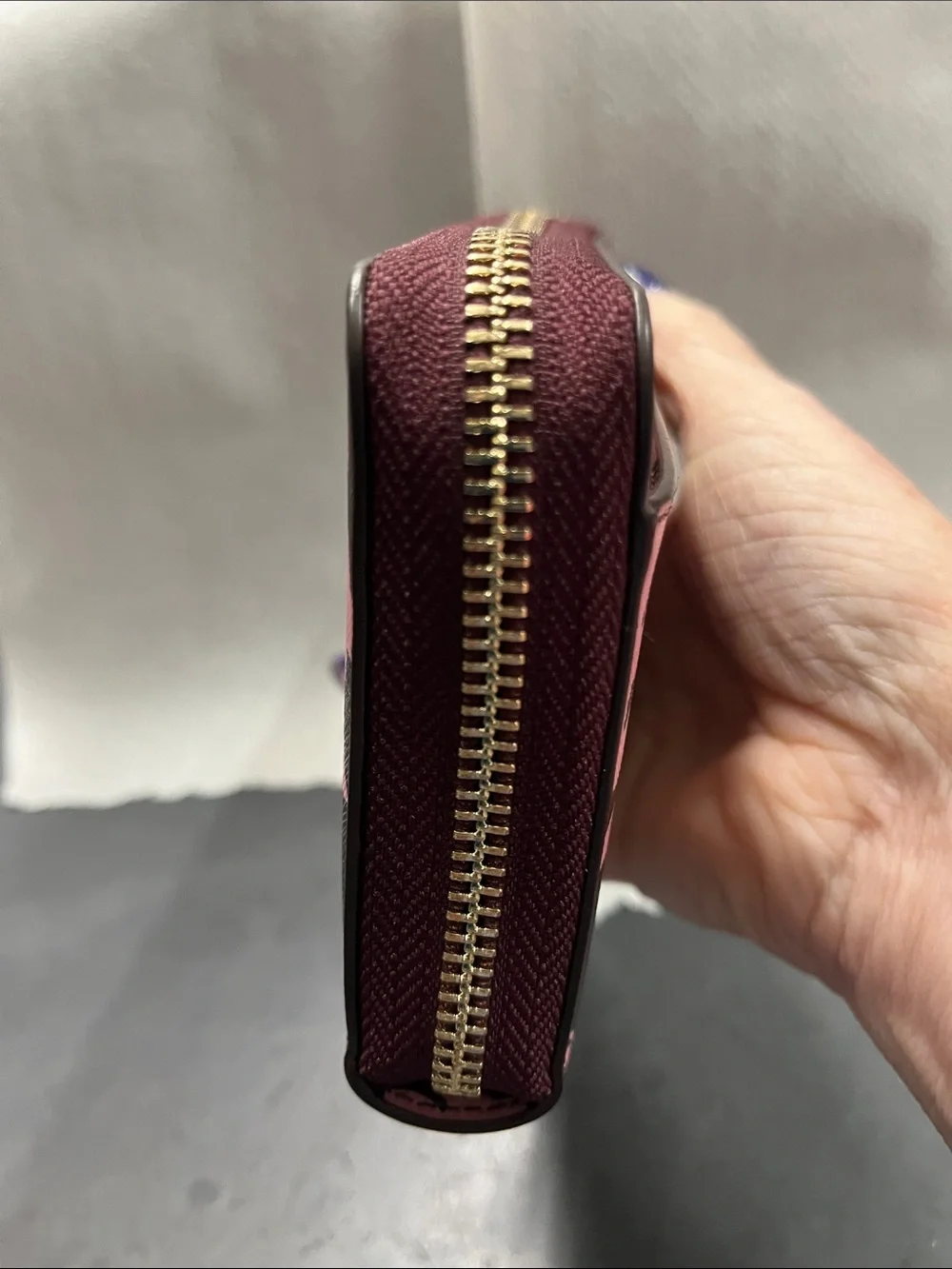NWOT Kate Spade pink floral on dark maroon zip-around wallet